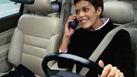 woman driving while talking on phone